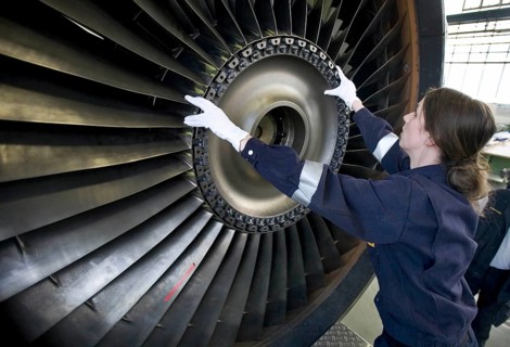Trainees in the training workshop of Trainico, training as aircraft mechanics on a jet engine,