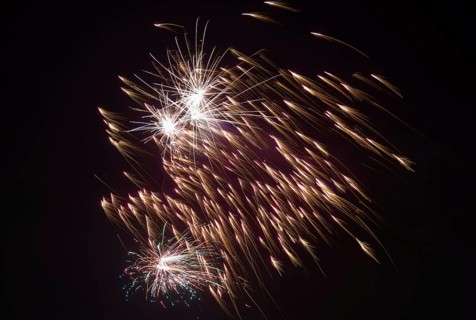 Bright sparks from fireworks spread across the night sky, Lower Saxony, Germany, Europe