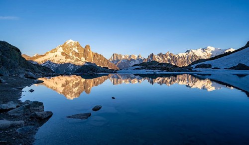 Evening mood, mountain landscape at sunset, alpenglow, water reflection in Lac Blanc, mountain