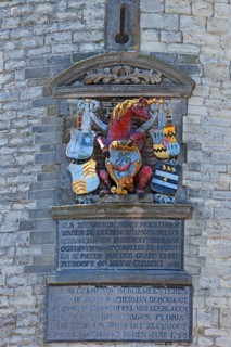 City coat of arms with unicorn on the historic Hoofdtoren defence defence tower in the harbour of