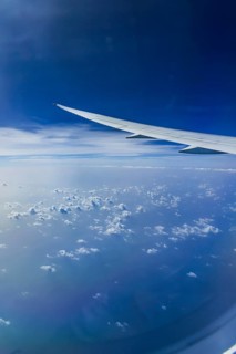 Blue sky, cloud structures over the Arabian Sea. View from the aircraft window during a flight from
