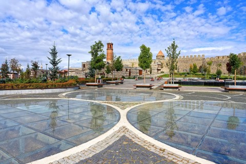 Reflections in the glass grounded Kale city park and Erzurum byzantine castle, Anatolia, Turkey,