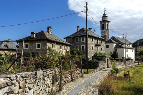 View of the village, typical Ticino stone houses in the mountain village of Rasa, Centovalli,