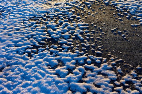 Snow cover with contrasting patterns in the light of the setting sun, winter, Wasserkuppe,