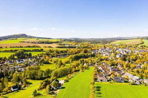 Town view of Schlettau from the air in autumn, Scheibenberg in the background, Erzgebirge, Saxony,