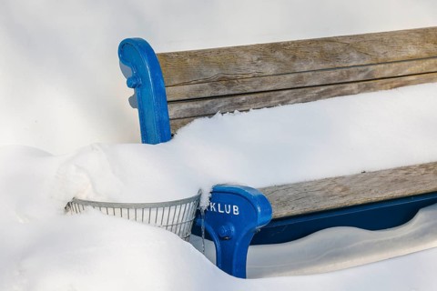 Hamm, North Rhine-Westphalia, Germany - Ice and snow on the river Lippe, bench with snow, rowing