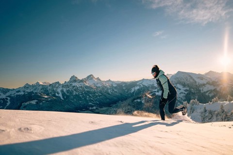 Summit bliss in the snow-covered winter landscape in the Tannheimer Tal in the Alps on the