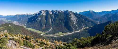Autumnal mountain forest, yellow-coloured larches, ascent to the Große Arnspitze, view of mountain