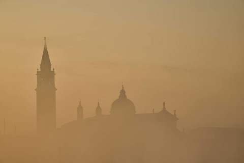 View from 'Colonna di San Marco e San Teodoro' on church 'Giorgio Maggiore' on a foggy morning at