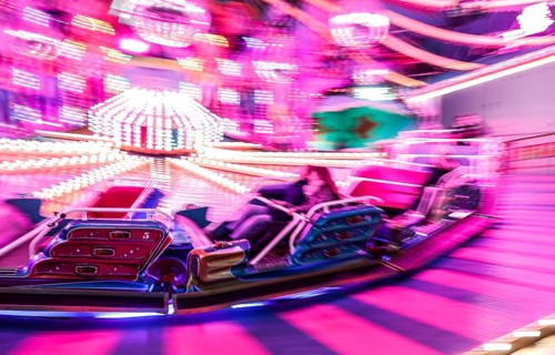 Visitors ride in a Musik Express ride, Berlin, 09.12.2022