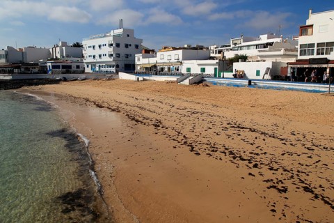 Sandy beach backed by bars and hotels in Corralejo, Fuerteventura, Canary Islands, Spain, Europe