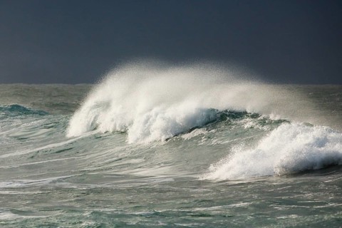 Big wave breaks in the open sea on the Breton coast near Brest, France, Europe