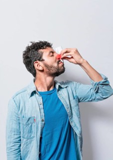 Person with nasal congestion, Person with irritated nose on isolated background, man with red nose