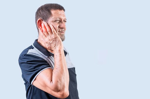 Senior man suffering from ear pain isolated. Person with otitis and tinnitus. Senior people with