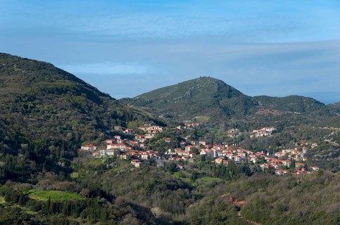 Idyllic view of a village with orange-coloured roofs and lush vegetation, Andritsena,