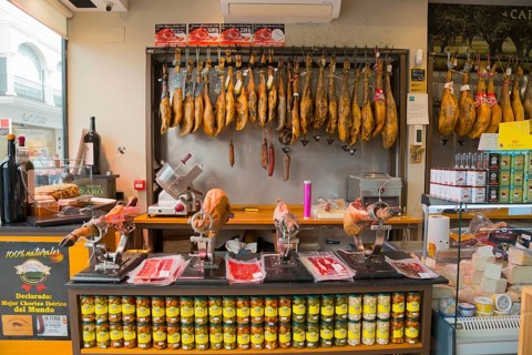 Spanish butcher's shop with a large selection of hung hams and fine sausage specialities, old town,