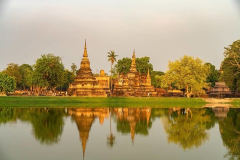 The central Buddhist temple Wat Mahathat in the UNESCO World Heritage Sukhothai Historical Park,