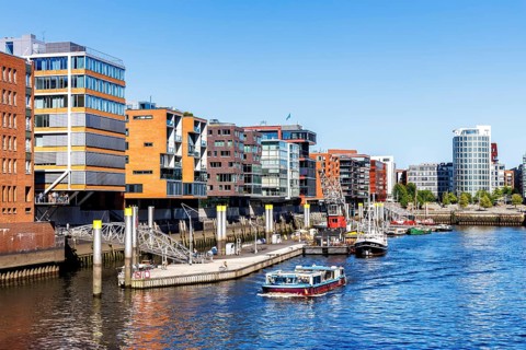Building in the HafenCity Sandtorhafen harbour with boats in Hamburg, Germany, Europe