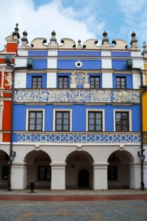 Magnificent Renaissance building with blue façade and ornate decorations under arcades, Great