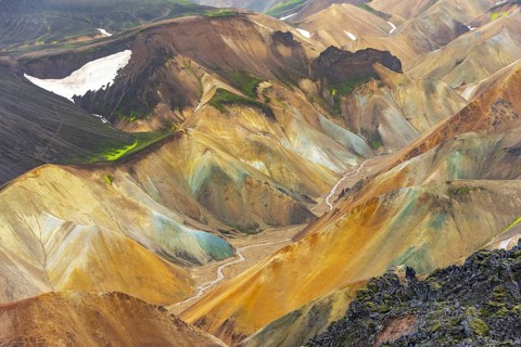Small river between colourful rhyolite mountains, volcanic landscape, erosion landscape, view from
