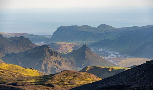 Volcanic mountain landscape overgrown with moss, atmospheric mountain landscape in the evening