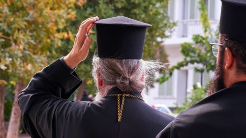 Archbishop Amphilochios, Orthodox priest taking off his hat outside, visit of Federal President