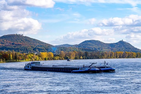 Cargo ship on the Rhine near Bonn, valley driver, in the background the Siebengebirge, North