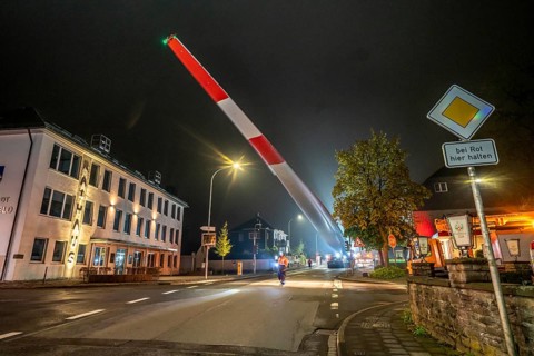 Transport of a 68 metre long, 22 tonne blade of a wind turbine, here in Breckerfeld, with a