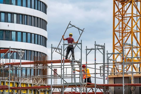 Construction site, construction of an office building, scaffolding, concrete worker, Düsseldorf,