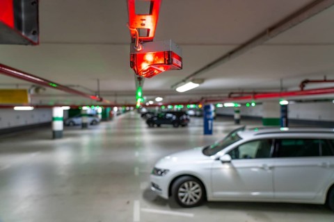 Underground car parks, multi-storey car parks, red or green lamps on the ceiling, show drivers