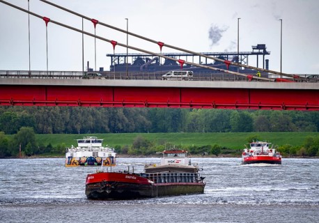 Cargo ships on the Rhine near Duisburg, near Ruhrort harbour, Friedrich Ebert Bridge, behind