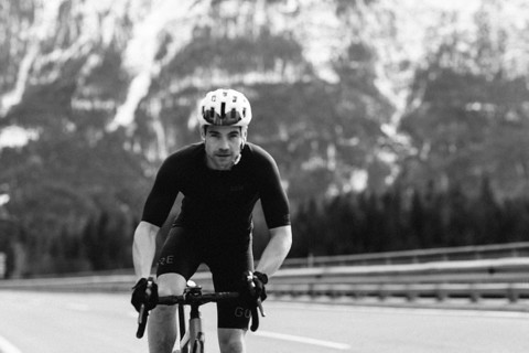 Road bike rider in spring between Lechtal and Tannheimer Tal in front of picturesque scenery of the
