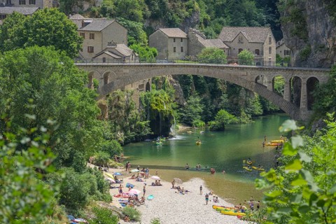 View of the village of Saint Chely with bridge and waterfall, Gorges du Tarn Causses, Département
