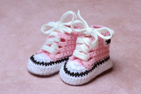 Baby shoes with pink background, handmade