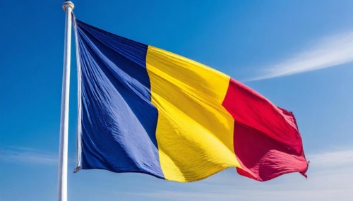 Flags, the national flag of Chad flutters in the wind
