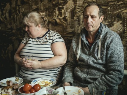 Misha and his woman in the dining room of their house in Voloska Balakliia. The village is close to