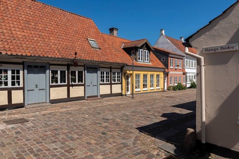 Odense, cobblestone street in the old town, half-timbered house, colourful houses, eaves houses,