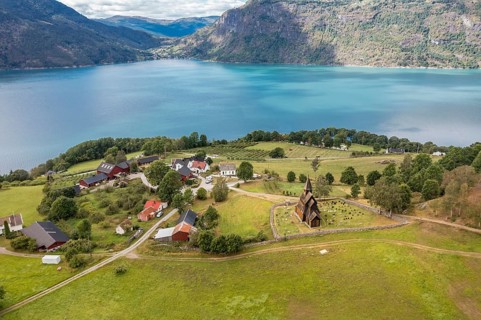 Aerial view of Urnes stave church, Lustrafjord, inner branch of the Sognefjord, Norway, Europe