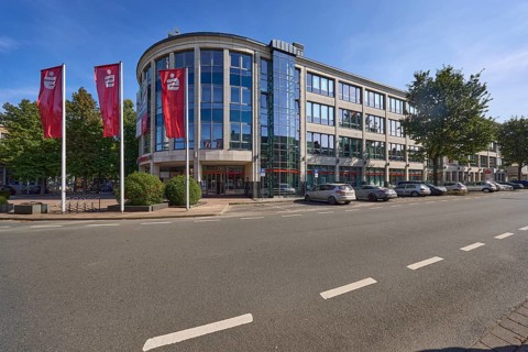 Head office of Niederrheinische Sparkasse RheinLippe with flags on Bismarckstraße in Wesel, Lower