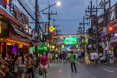 Crowds of people on Bangla Street in the evening. Nightlife on Bangla Walking Street with go-go