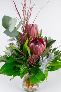Bouquet with protea and eucalyptus in vibrant colours, stylish composition, bouquet
