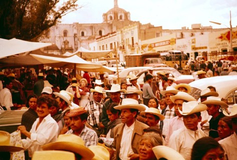 Crowds of people at a local festival in a small market town, Puebla state, Mexico 1961