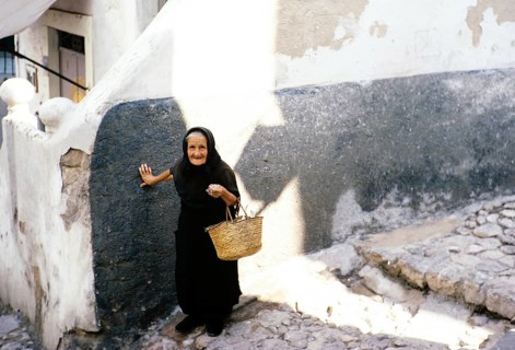 Old widow in black clothes in Ibiza Town, Ibiza, Balearic Islands, Spain 1967