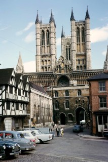People and cars on Castle Hill square near Lincoln Cathedral, Lincolnshire, England, 1963