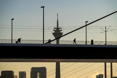 Pedestrians on the Oberkassler Rhine Bridge, Rhine Tower, behind the Rheinknie Bridge, Düsseldorf,