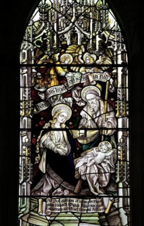Birth of Jesus, stained glass window above altar Church of Saint Mary, Coddenham, Suffolk, England,