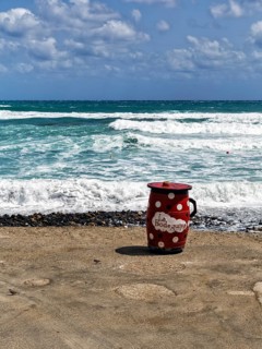 Red outdoor bar table, jug, bar with sea view, beach bar, Cabo de Gata Natural Park,