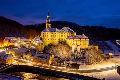 Winter evening in the Müglitz valley, impressively illuminated Weesenstein Castle at the blue hour,