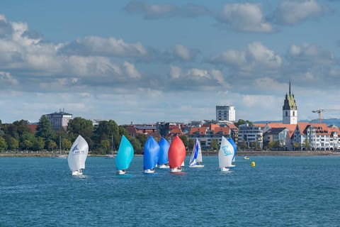 Cityscape, dinghies with spinnaker, church tower, St. Nicholas Church, Friedrichshafen on Lake