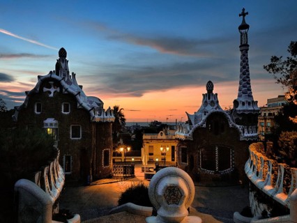 Building with mosaics, Park Güell entrance at dawn, in front of sunrise, Barcelona, Spain, Europe